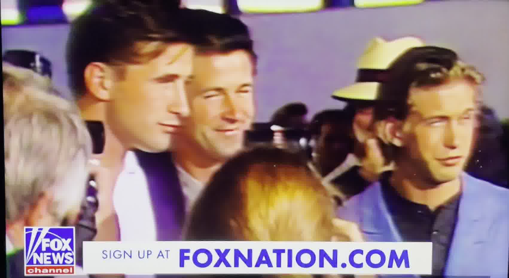 Two men are standing next to each other.